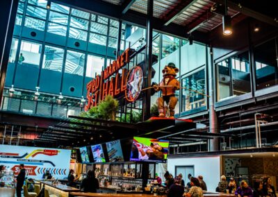 Interior photograph of 3rd Street Market Hall bar, with sculpture of bear next to sign.